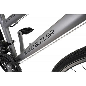 Detailed shot of the CLAUD BUTLER logo on the downtube of the silver low-step hybrid bike.