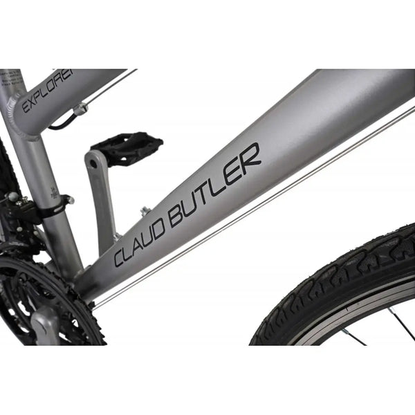 Detailed shot of the CLAUD BUTLER logo on the downtube of the silver low-step hybrid bike.