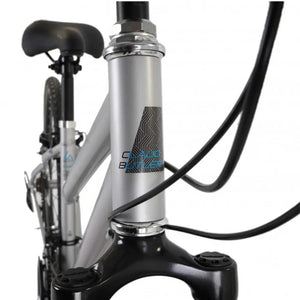 Close-up of the CLAUD BUTLER head tube logo and headset area on the silver low-step frame.