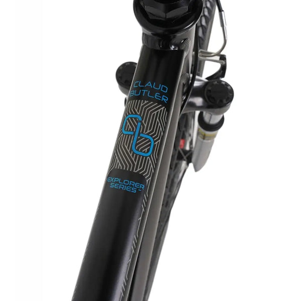 Close-up of the "EXPLORER SERIES" and "CLAUD BUTLER" logos on the downtube of the Explorer 1.0 hybrid bike.