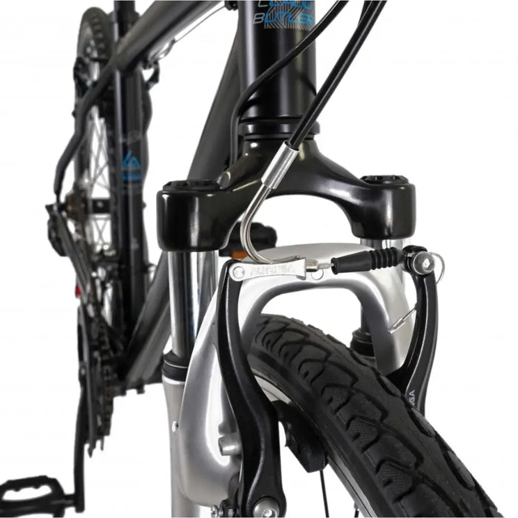 Close-up of the V-brake caliper and suspension fork detail on the front wheel of the Explorer 1.0.