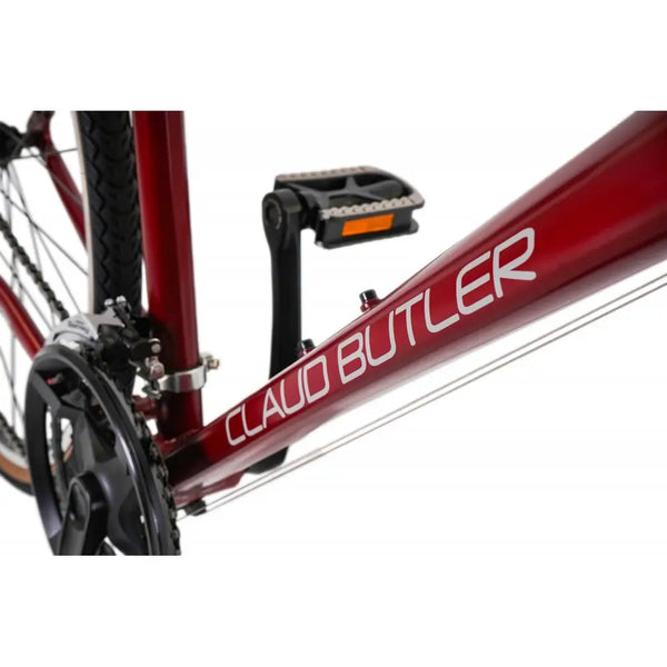 Detailed shot of the CLAUD BUTLER and EXPLORER 2.0 decals on the downtube of the red hybrid bike.