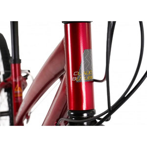 Close-up of the CLAUD BUTLER head tube logo and headset area on the metallic red frame.