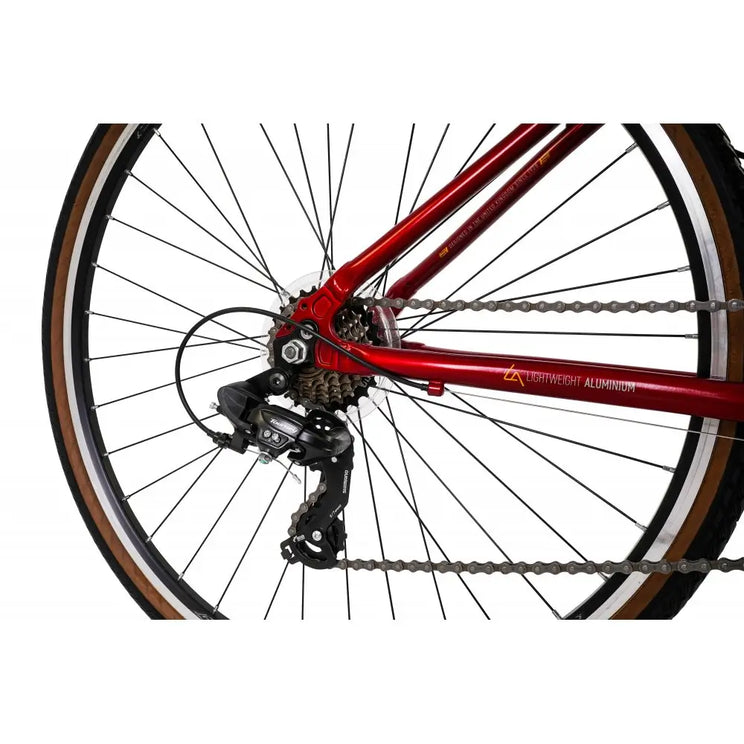 Close-up of the Shimano rear derailleur and 7-speed cassette on the red Explorer 2.0 Low Step.