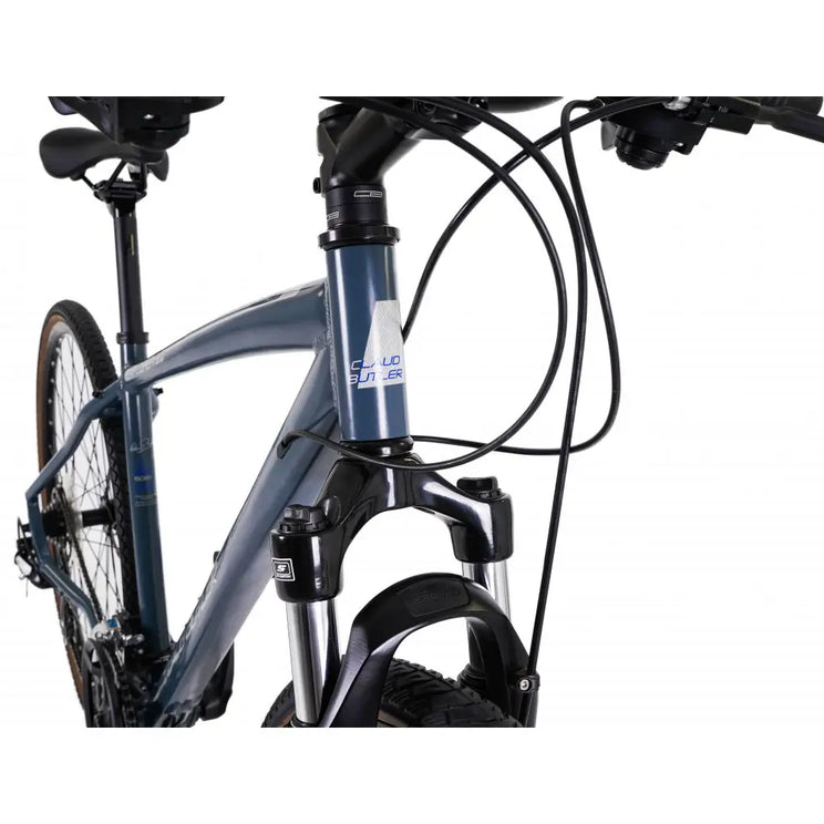 Close-up of the CLAUD BUTLER head tube logo and headset area on the metallic frame.