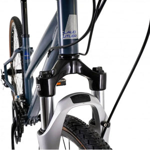 Close-up of the CLAUD BUTLER head tube logo and headset area on the metallic red frame.