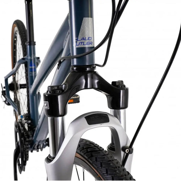 Close-up of the CLAUD BUTLER head tube logo and headset area on the metallic red frame.