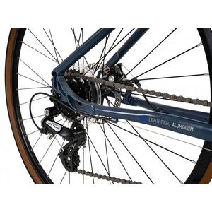 Close-up of the Shimano rear derailleur and 7-speed cassette on the red Explorer 3.0 Low Step.