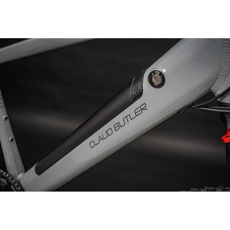 Detail of the Claud Butler Ridge 1.0 electric mountain bike 250W 2025 frame showing the integrated battery compartment and logo.