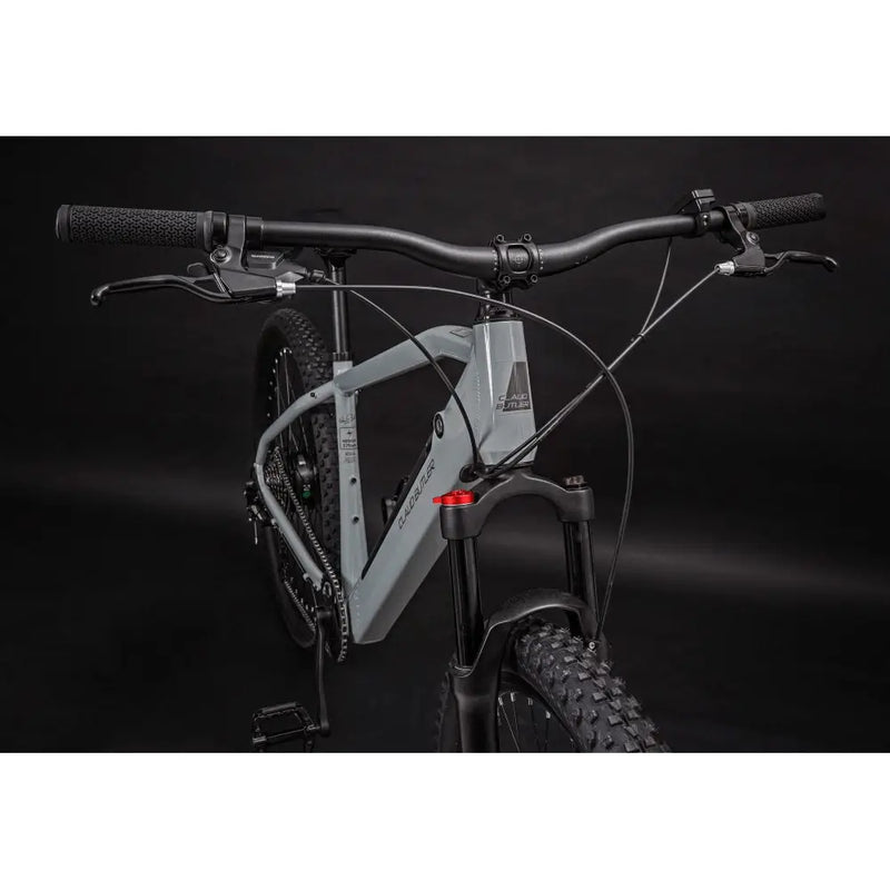 Front angled view of Claud Butler Ridge 1.0 electric mountain bike showing frame design and front suspension fork.