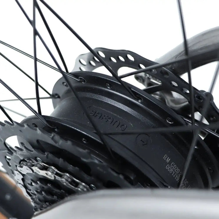 Detailed close-up of the Bafang rear hub motor on the Claud Butler Ridge 2.0 electric mountain bike with cassette and disc rotor.