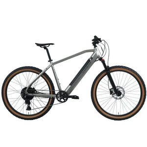Studio side view of the Claud Butler Ridge 2.0 Electric Mountain Bike (2025), featuring a hardtail frame, front suspension, disc brakes, and tan wall off-road tyres.