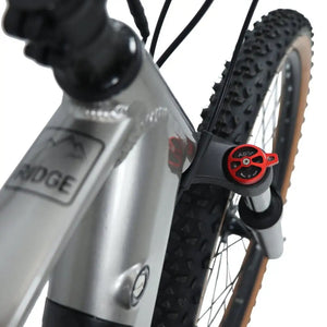 Close-up of the Claud Butler Ridge 2.0 electric mountain bike showing the front suspension fork with ABS+ adjustment knob and knobby tyre tread.