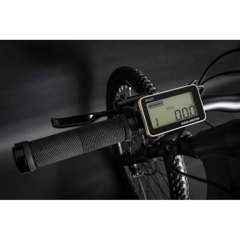 Close-up of the Claud Butler Wrath 1.0 Cues electric mountain bike LCD display showing speed and settings, mounted on the handlebar.