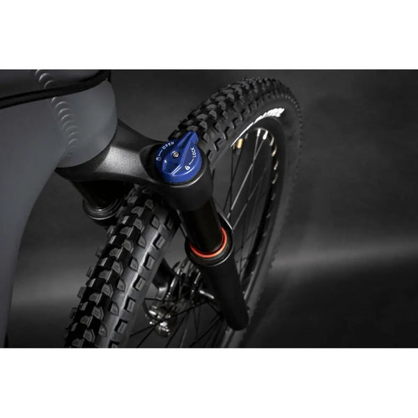 Close-up of the Claud Butler Wrath 1.0 Cues electric mountain bike front suspension fork, designed for smooth handling and control on rugged trails.