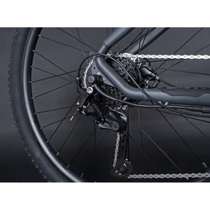 Rear derailleur and cassette of the Claud Butler Wrath 1.0 Cues electric mountain bike, highlighting the gear system and chain detail.