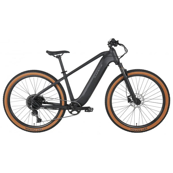 Full side profile of the Claud Butler Wrath 2.0 Cues electric mountain bike, showing the integrated battery, black frame, and tan wall tyres designed for off-road riding.