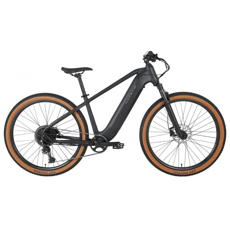 Full side profile of the Claud Butler Wrath 2.0 Cues electric mountain bike, showing the integrated battery, black frame, and tan wall tyres designed for off-road riding.