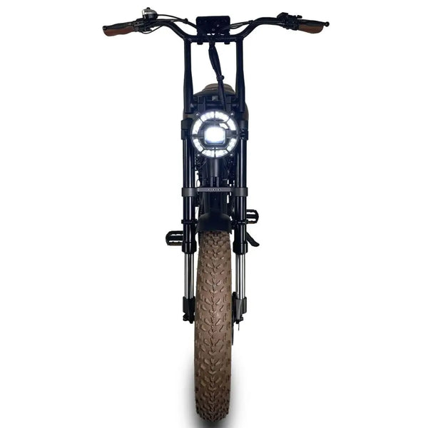 Front view of the Cruz73 Mariner Retro Special Edition electric bike with illuminated round headlight and wide tyres.