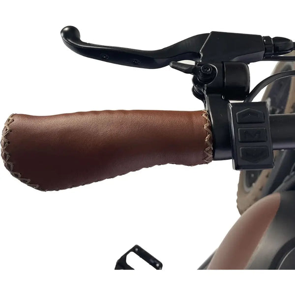 Close-up of the Cruz73 Mariner Retro Special Edition electric bike brown stitched handle grip with control buttons.