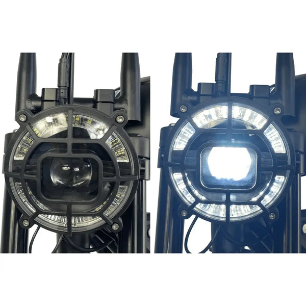 Close-up of the Cruz73 Mariner Retro Special Edition electric bike round LED headlight shown off and illuminated.