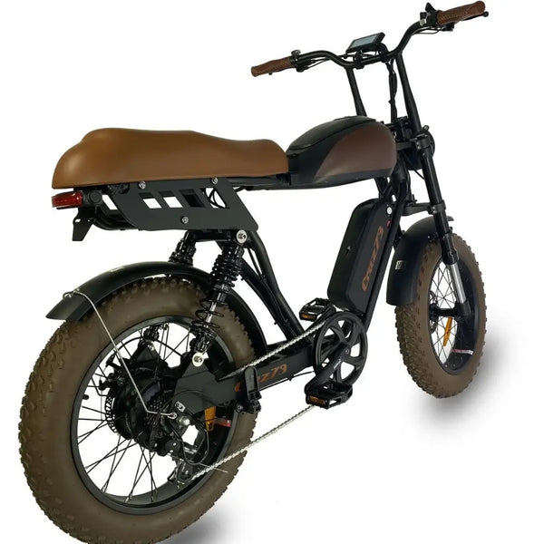 Rear-side view of the Cruz73 Mariner Retro Special Edition  electric bike with brown seat and fat tyres.