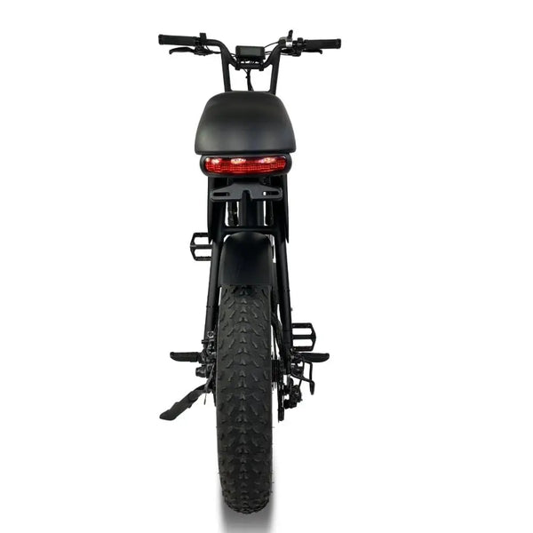 Rear view of the Cruz73 Pro retro-style fat tyre electric bike, showcasing its wide tread, rear light, and sleek matte black finish for off-road and private property riding.