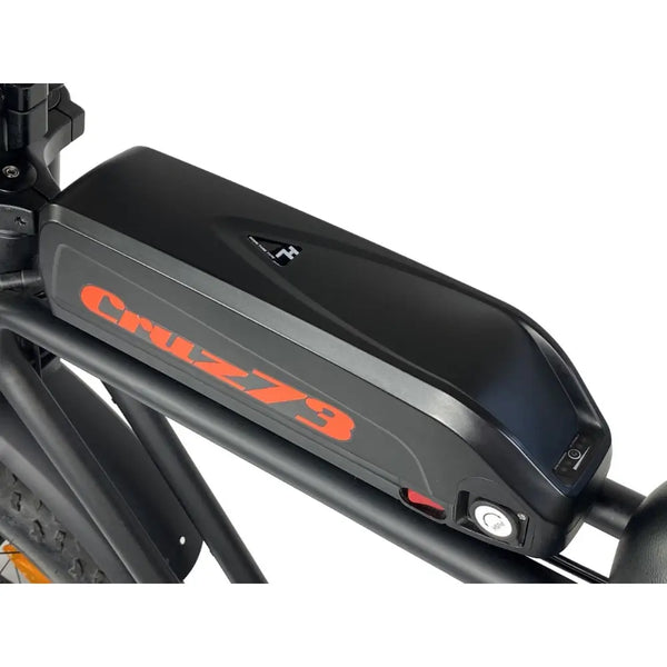 Close-up of the Cruz73 Unlimited Retro Fat Tyre 750W electric bike battery mounted on the top frame.