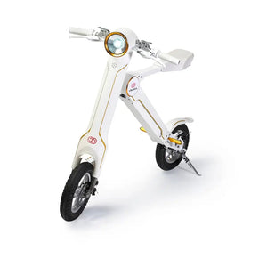 Front angle studio view of the white Cruzaa E-Scooter Pro, clearly displaying the unique 'K' frame shape and front disc brake.