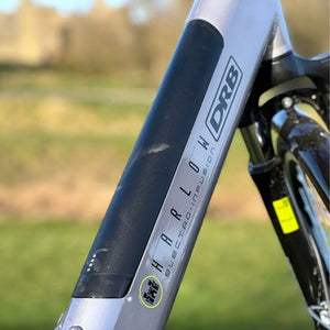 Close-up of the black integrated battery on the Dallingridge Harlow downtube, showing the charge level indicator and branding.