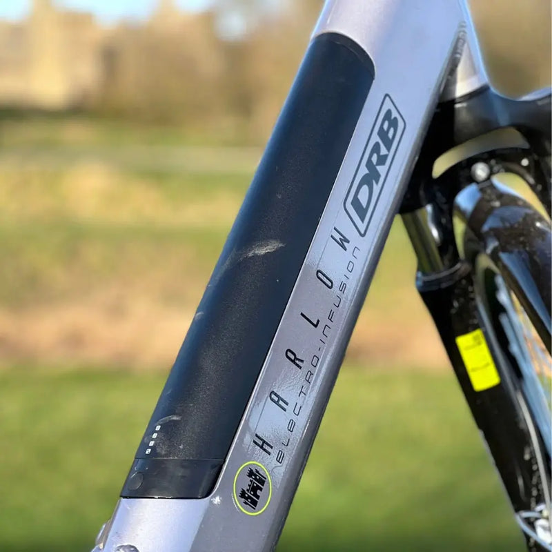Close-up of the black integrated battery on the Dallingridge Harlow downtube, showing the charge level indicator and branding.
