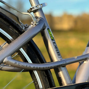 Close-up of the rear frame stays on the Dallingridge Harlow electric bike, highlighting the "Power Assisted Cycling" text and silver alloy construction.