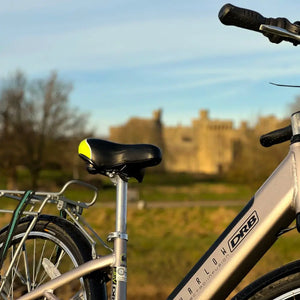 Close-up of the black and yellow saddle on the Dallingridge Harlow e-bike.