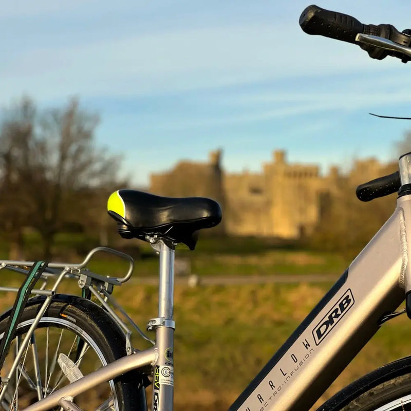 Close-up of the black and yellow saddle on the Dallingridge Harlow e-bike.