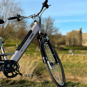 Front-angled shot of the Dallingridge Harlow electric bike showing the front suspension fork, disc brakes, and silver step-through frame.