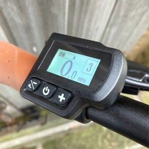 Close-up of the handlebar-mounted digital LCD display on the Dallingridge Malvern showing speed, battery level, and assist mode.
