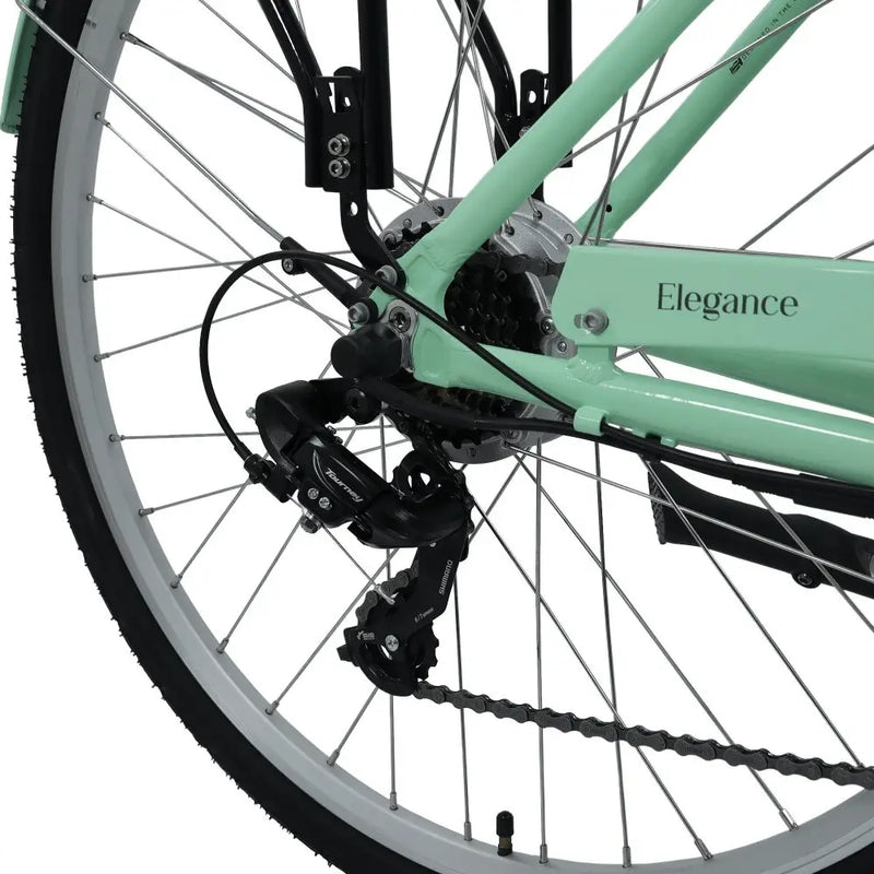 Close-up of the Dawes Elegance Low Step Electric Bike’s rear derailleur, wheel, and cassette with Shimano Tourney gear system.