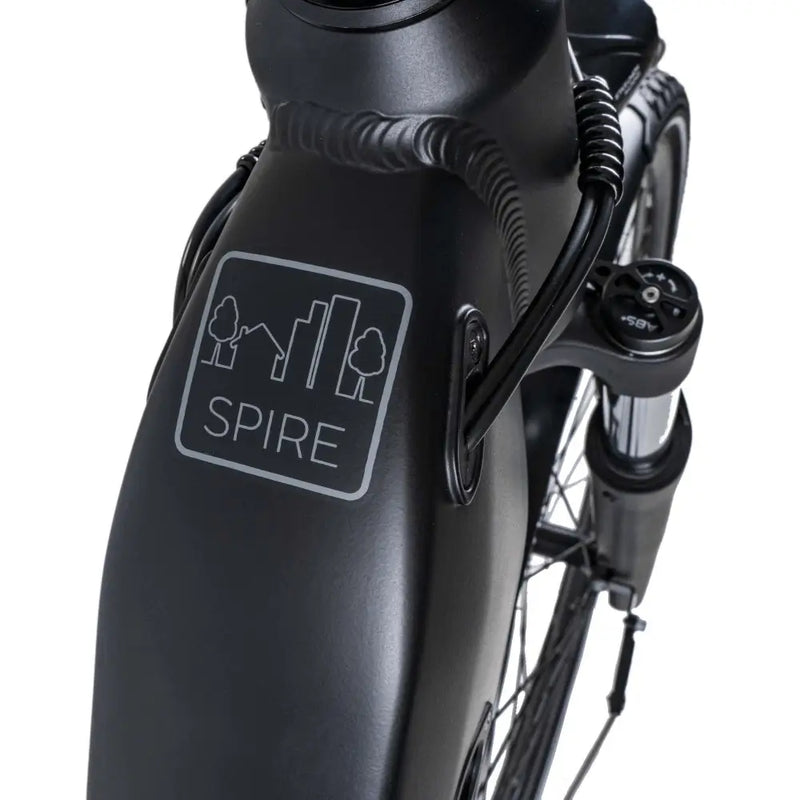 Close-up of the Dawes Spire 1.0 Low Step electric hybrid bike’s front frame with Spire city and trees logo.
