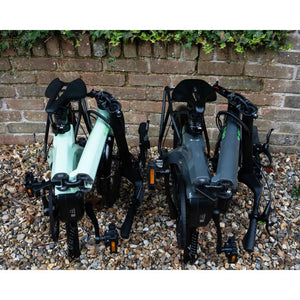 Two E-Go CarbonLite electric bikes fully folded and demonstrate compact size.