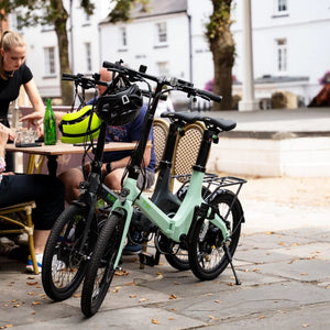 E-Go CarbonStep folding e-bikes parked outside a cafe