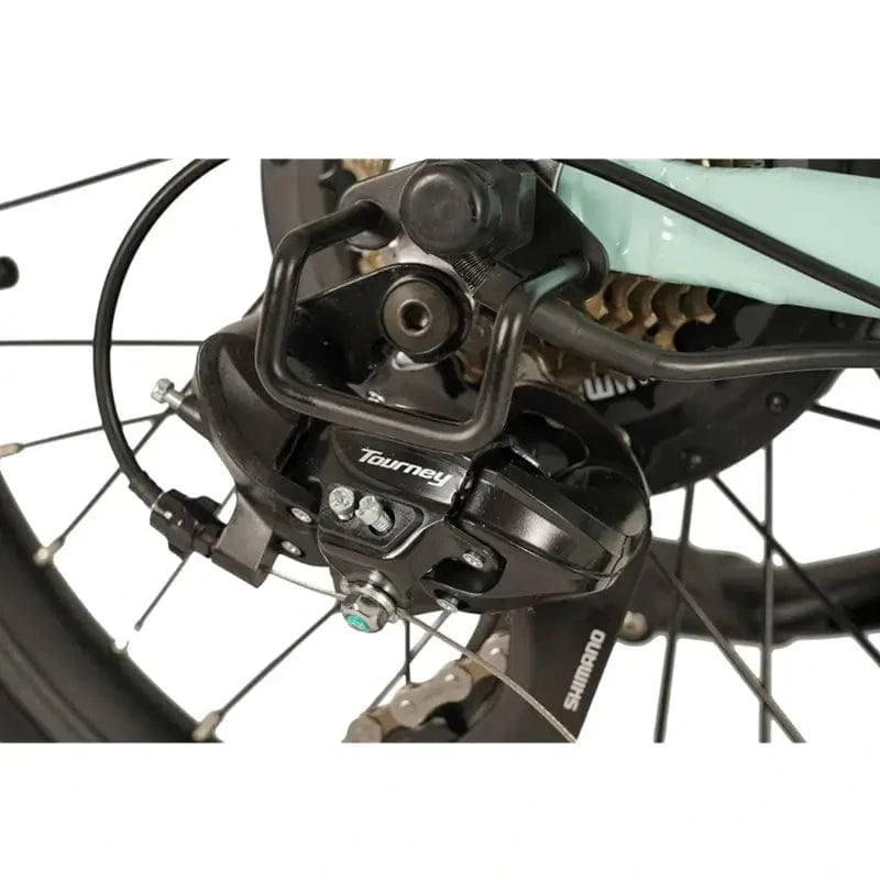 Close-up of the Shimano Tourney rear derailleur on the E-Go Low Step electric bike, ensuring smooth shifting through the 7-speed drivetrain.