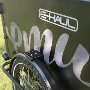 Emu E-Haul cargo box close-up with E-Haul logo above the front wheel