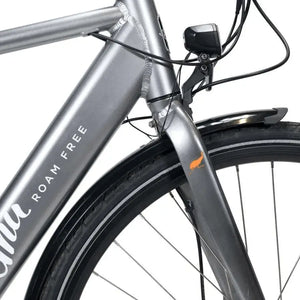 Close-up of the front suspension fork, integrated light, and Emu logo on the grey crossbar electric bike.