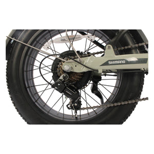 Close up of the Shimano 7 speed rear derailleur beside the fat rear tyre on the Emu folding e bike