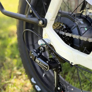 Close up of Shimano rear derailleur and cassette on the cream Emu Longtail cargo e-bike.