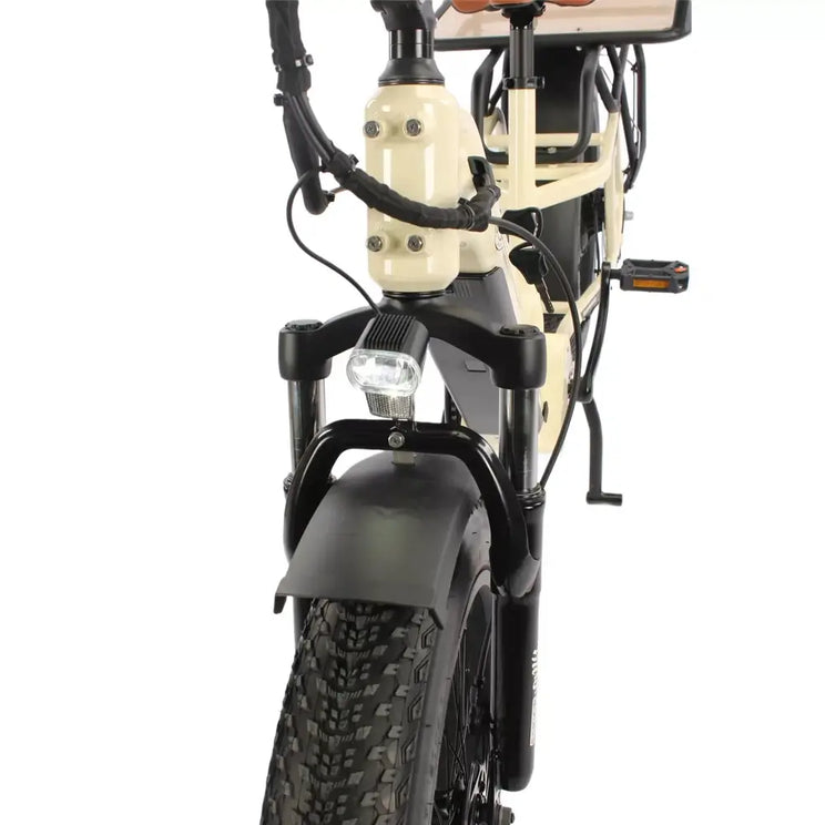 Front suspension fork and headlight on the cream EMU Longtail cargo electric bike with fat tyre.