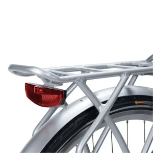 Detail shot of the silver aluminium rear pannier rack and integrated red LED tail light on the Emu Roam electric bike.