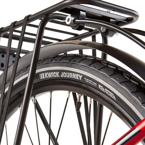 Close-up of the Kenda Kwick Journey puncture-resistant tyres on the EZEGO Commute EX, showing the reflective sidewall strip and sturdy rack stays.