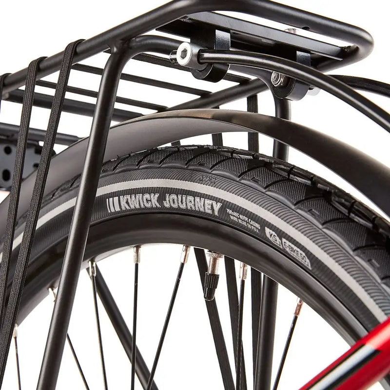 Close-up of the Kenda Kwick Journey puncture-resistant tyres on the EZEGO Commute EX, showing the reflective sidewall strip and sturdy rack stays.