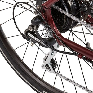 Detail of the Shimano Acera rear derailleur on the EZEGO Commute Ex, responsible for smooth and reliable gear changes on the 8-speed cassette.